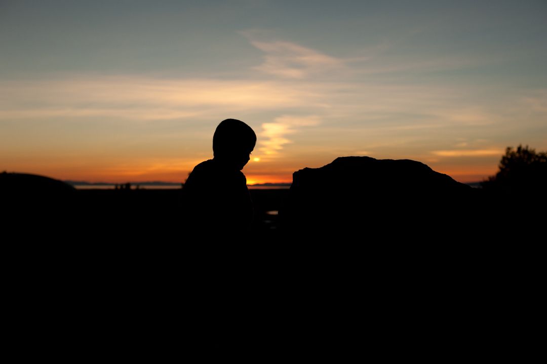 Marshall in a sunset photo at Beus Pond in Ogden, Utah.