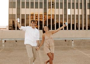 Four sequential photos showing a couple dancing and twirling in an outdoor courtyard with white walls.