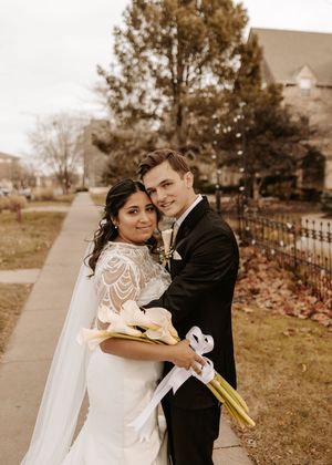 A romantic wedding photo series showing a couple embracing outdoors in autumn with the bride wearing a lace dress.