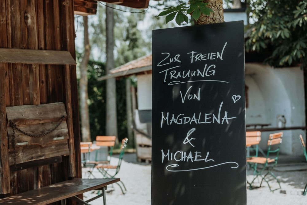 Rustic chalkboard signs displaying names create a personalized wedding decor element.