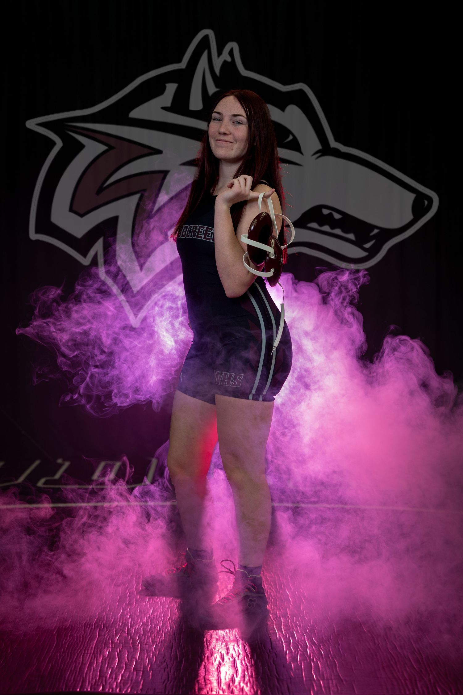 A dramatic photo series showing a dancer in black against pink smoke effects on a dark background.