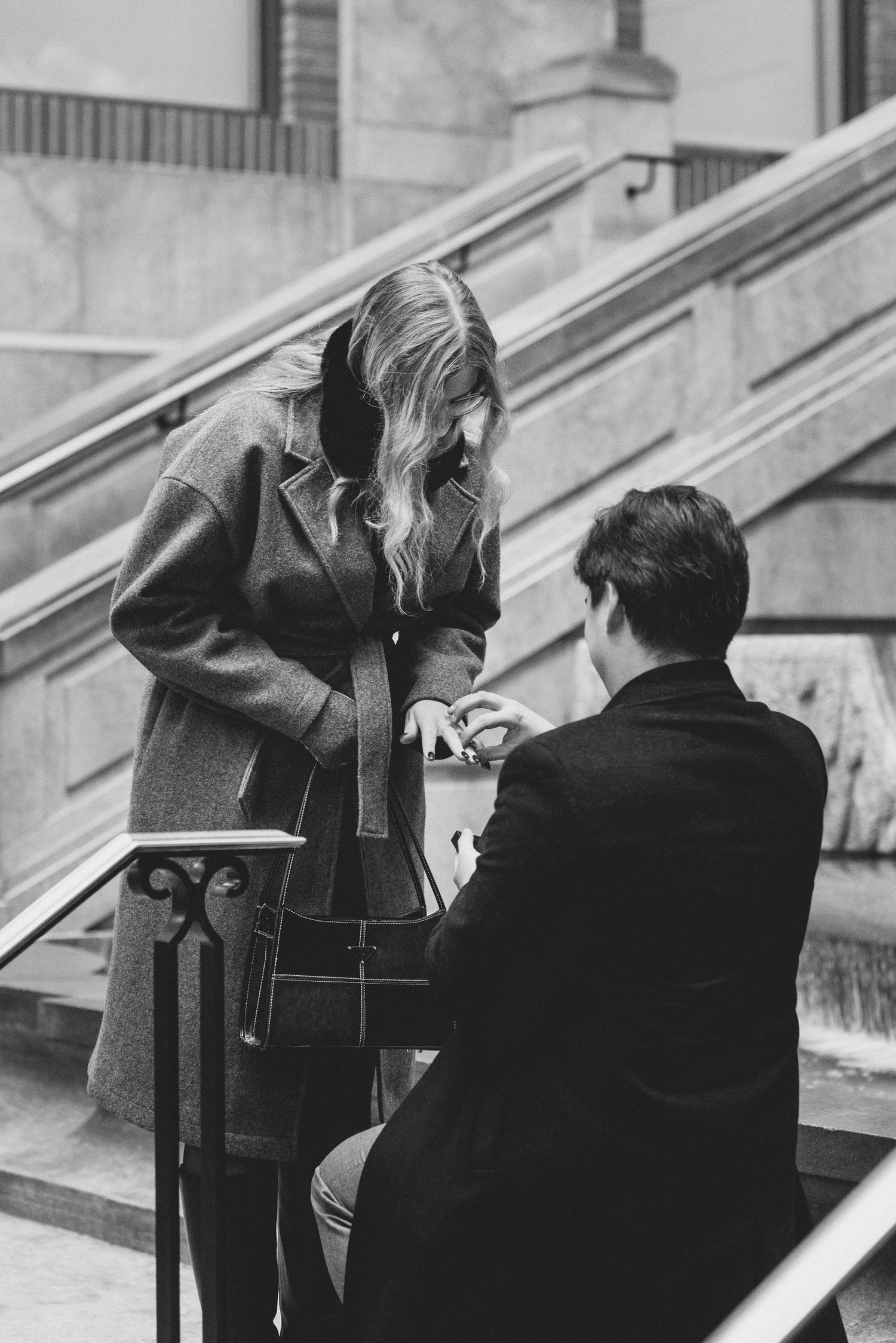 A black and white photo sequence shows two people sitting on steps engaged in intimate conversation.