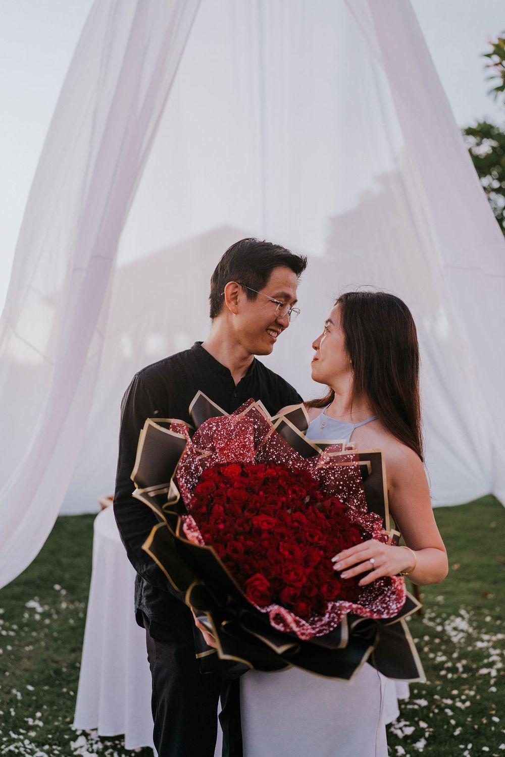 Romantic Bali photoshoot services for engagement moments at Maya Sanur.