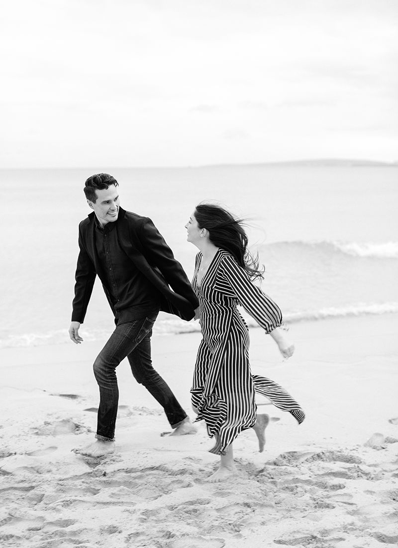 couple walking on beach engagement photos mallorca