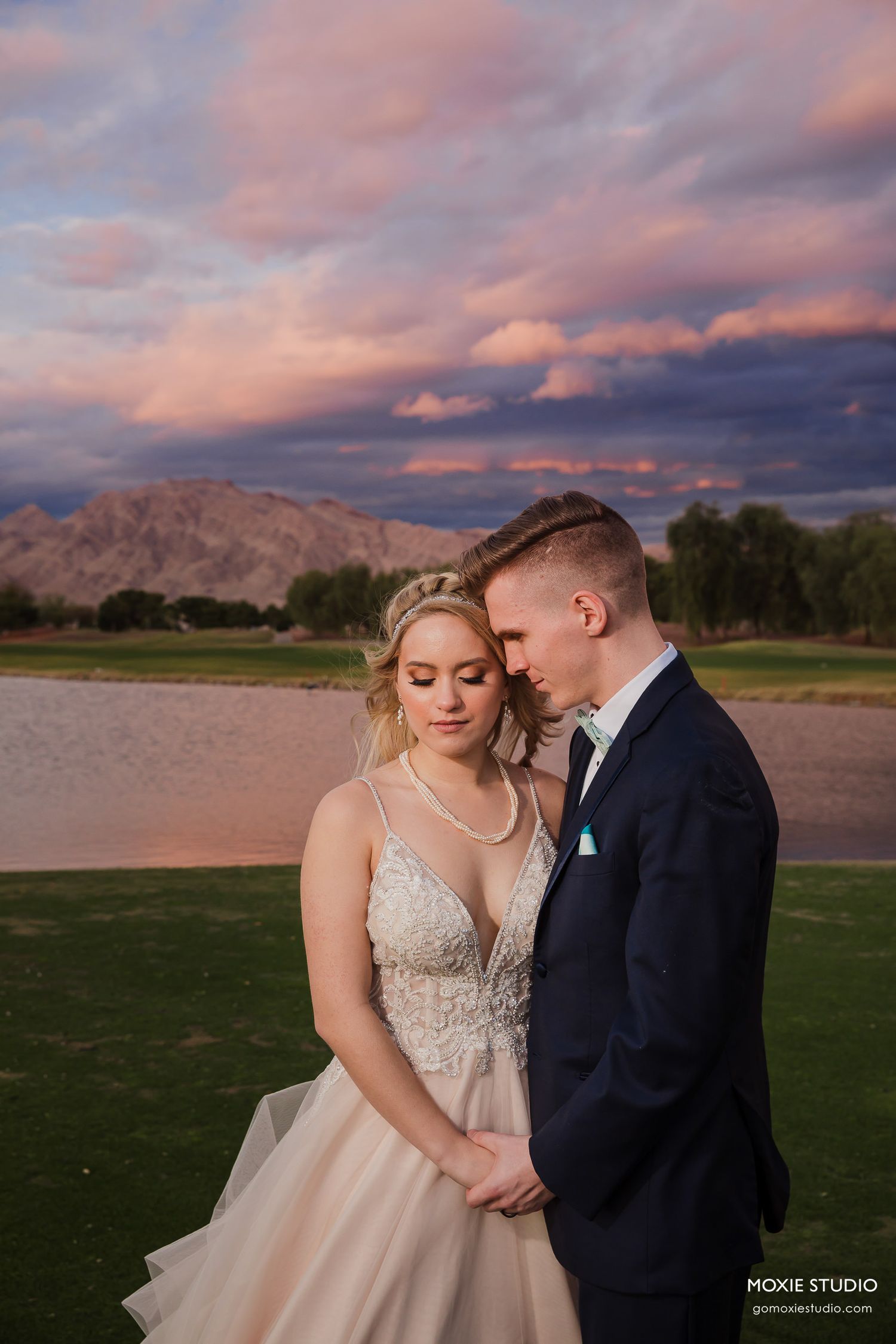 bride and groom portraits at DragonRidge Country Club sunset