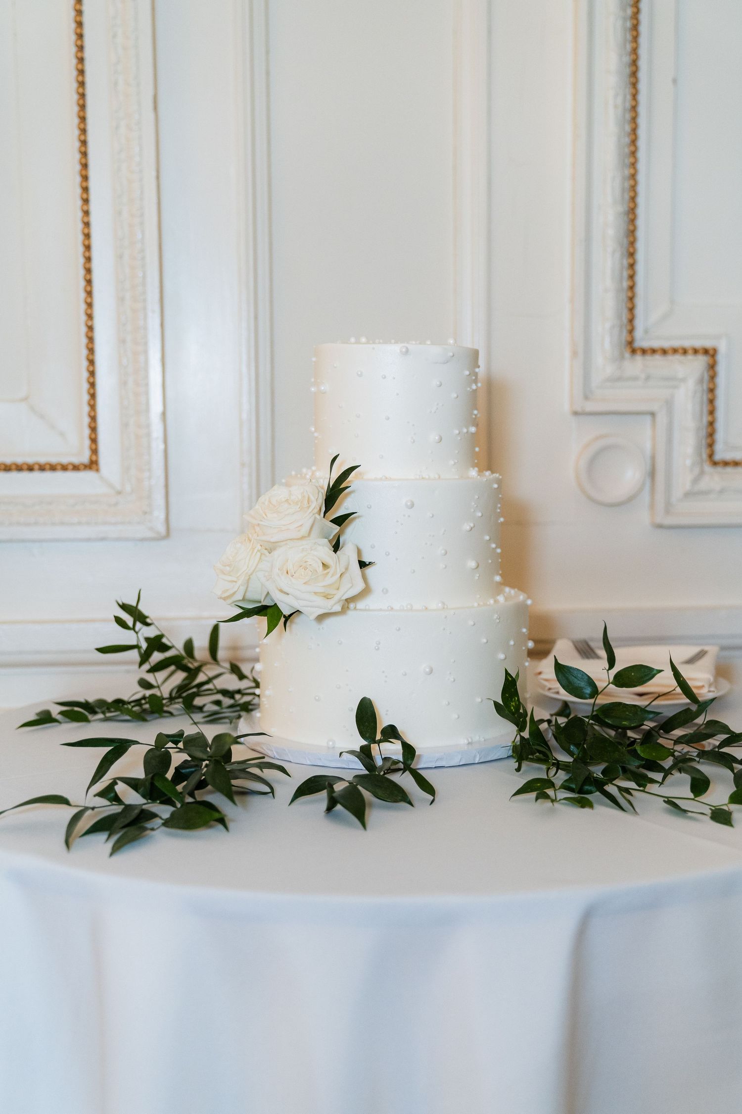 Wedding cake display at Tupper Manor in Beverly, MA during an elegant reception.