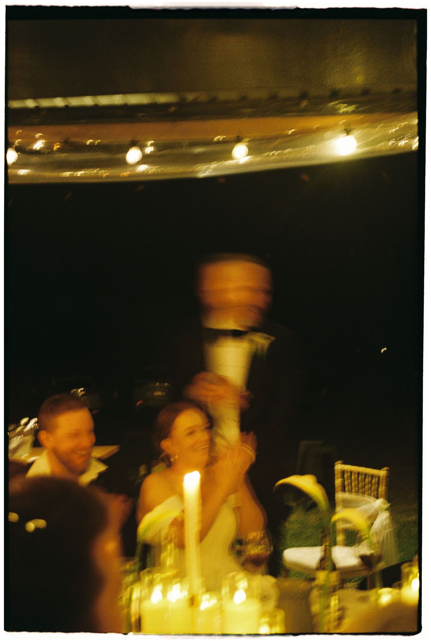 Blurry motion-filled photos of performers on a dimly lit stage during a live music performance.