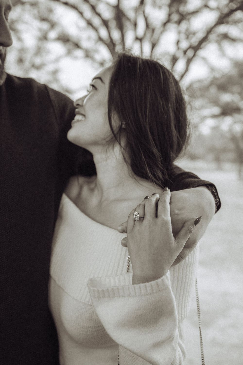 Artistic black and white portrait series showing intimate romantic moments between a couple in soft lighting.