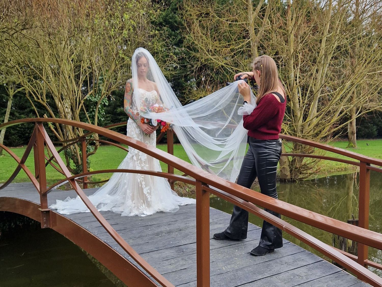 Sequence of wedding photos showing flowing veil movement along wooden bridge railing near water.