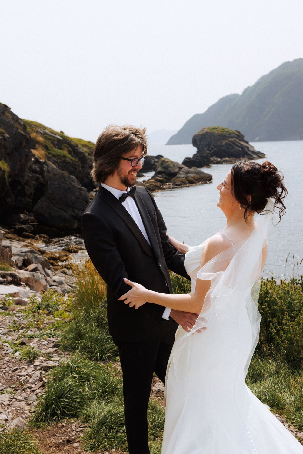 Bride and groom share first look in Dunfield on Bonavista Peninsula by Newfoundland documentary wedding photographer Kaitlyn Yvette