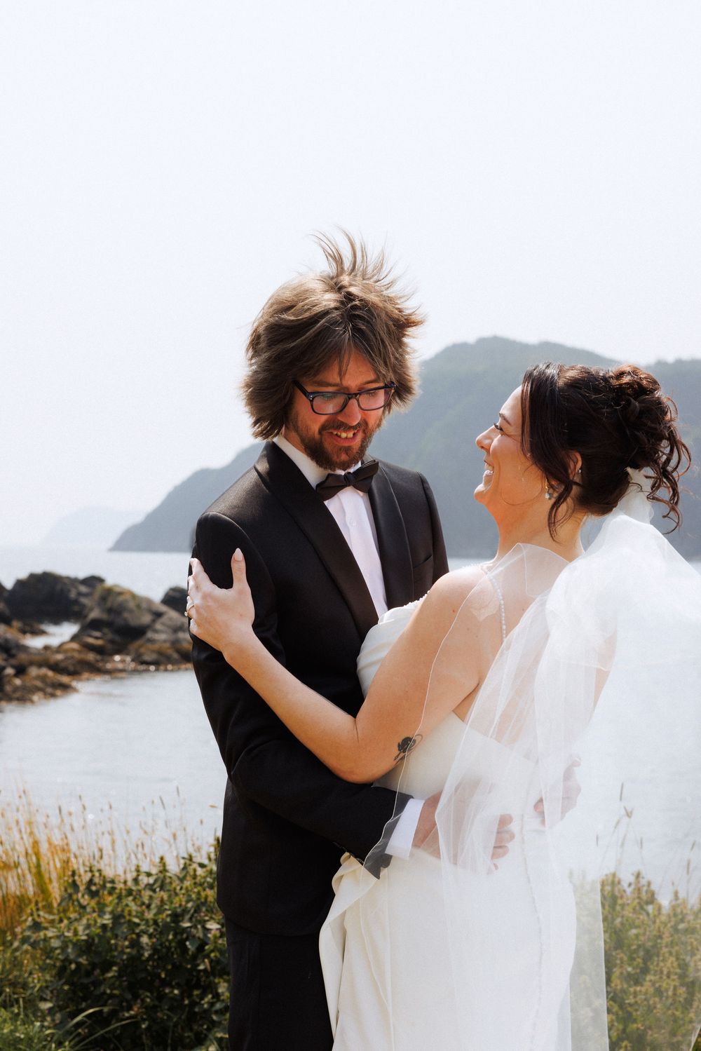 Bride and groom share first look in Dunfield on Bonavista Peninsula by Newfoundland documentary wedding photographer Kaitlyn Yvette