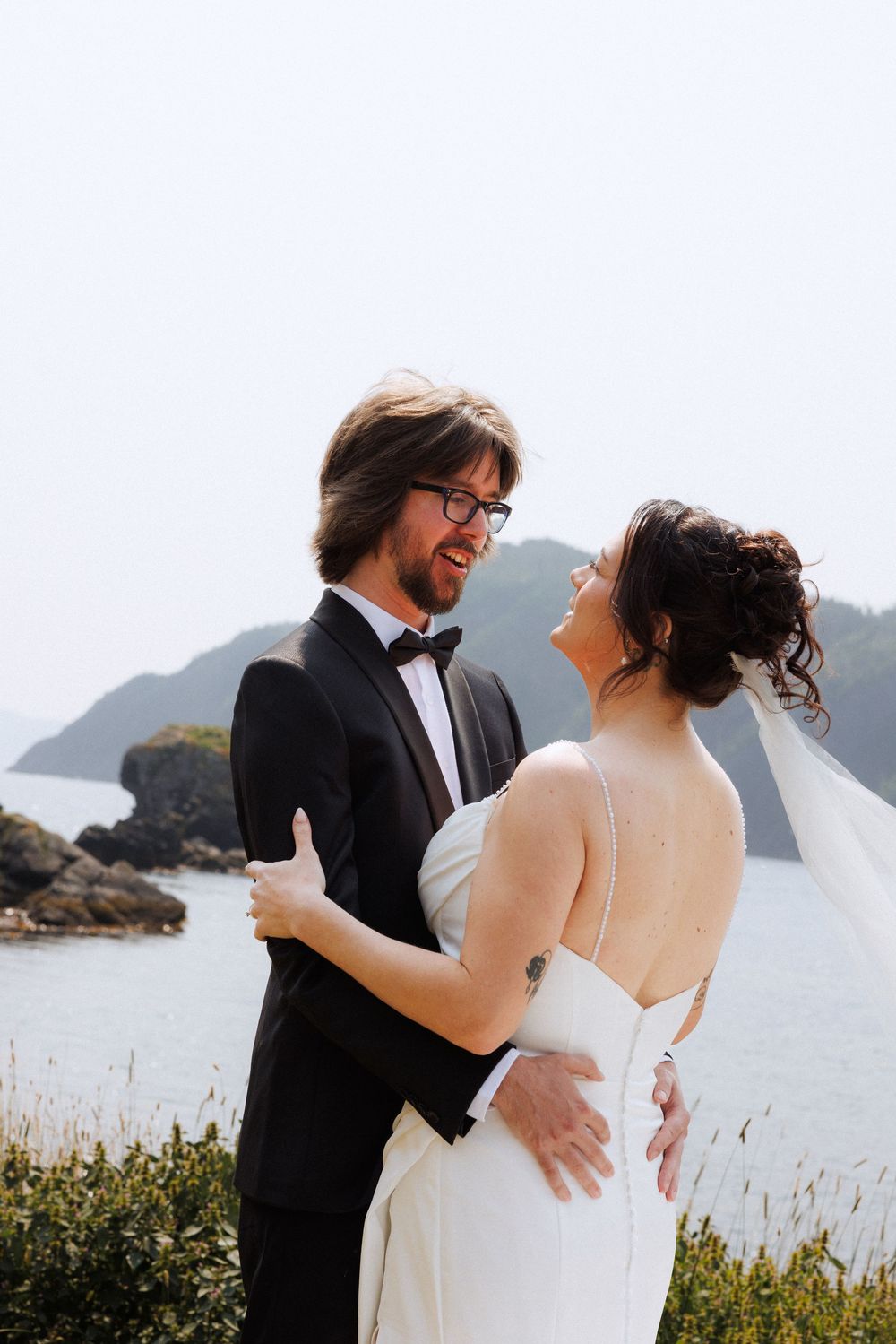 Bride and groom share first look in Dunfield on Bonavista Peninsula by Newfoundland documentary wedding photographer Kaitlyn Yvette