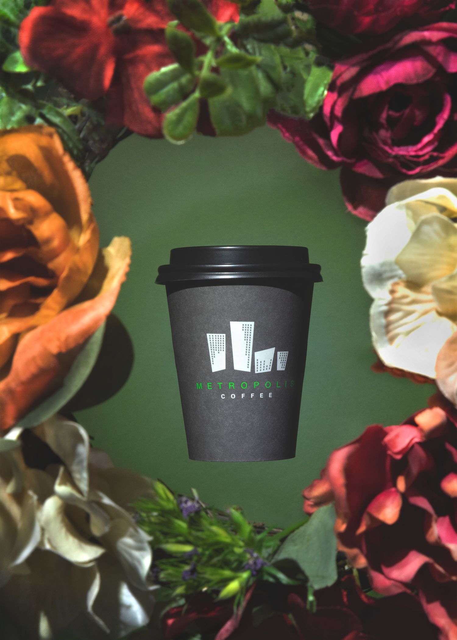 Product photography featuring a coffee cup surrounded by floral elements, created by commercial photographer Chris Z of Zeng Studio.