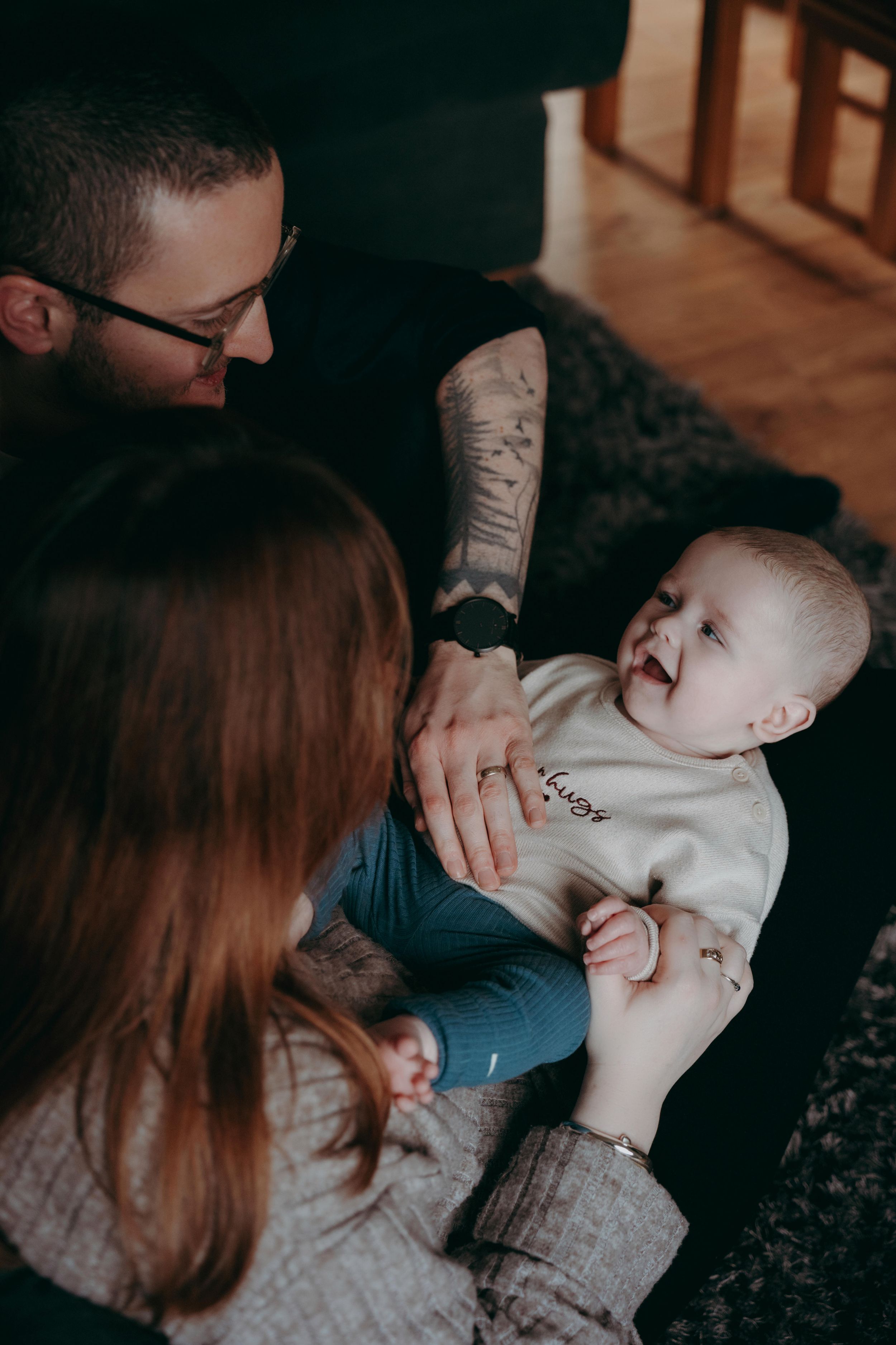 A tender family moment shows parents interacting lovingly with their baby in a series of intimate indoor photos.