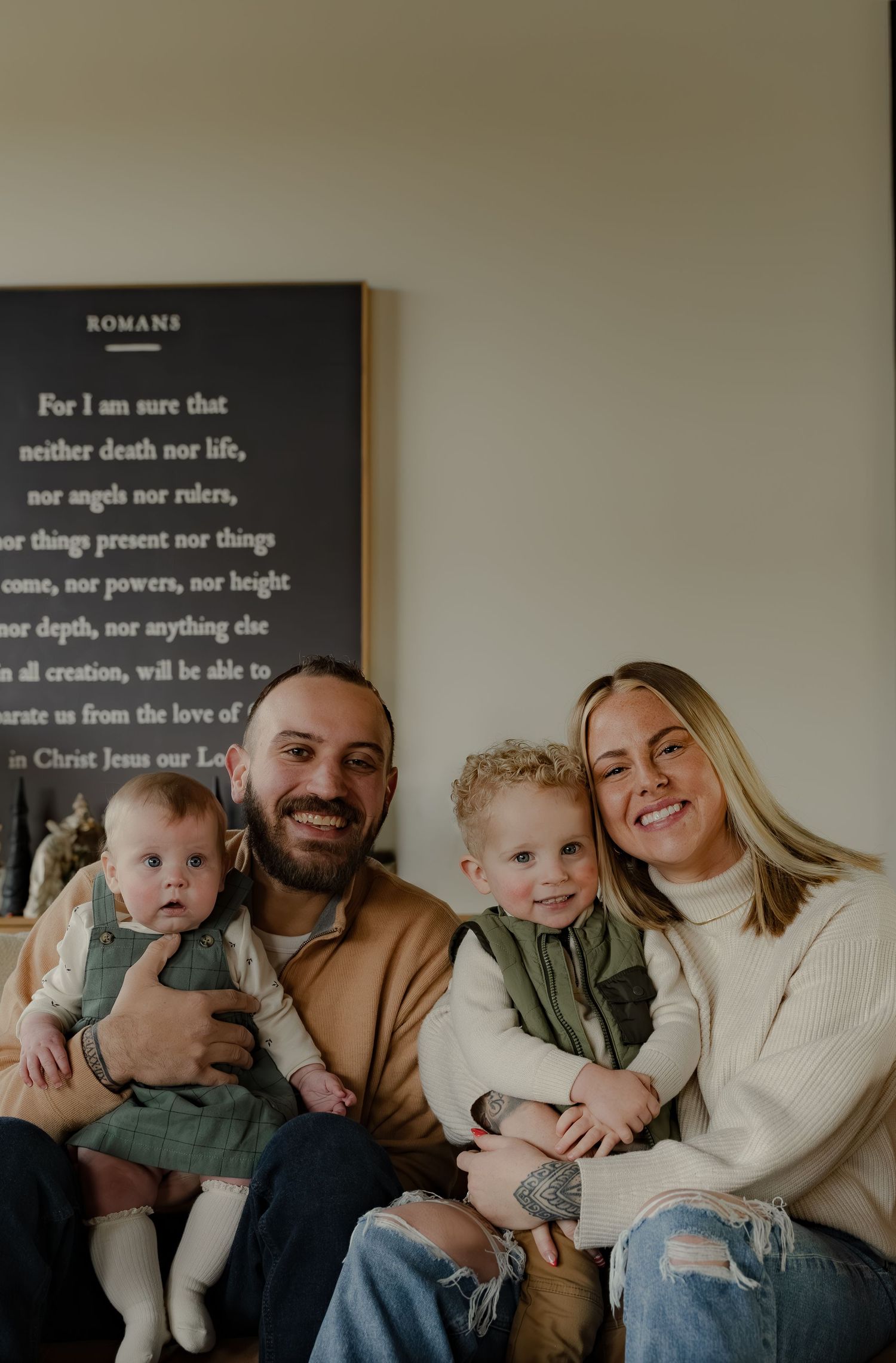Family of four with Romans verse wall art — Goodness Kabuswe lifestyle family photographer central Illinois
