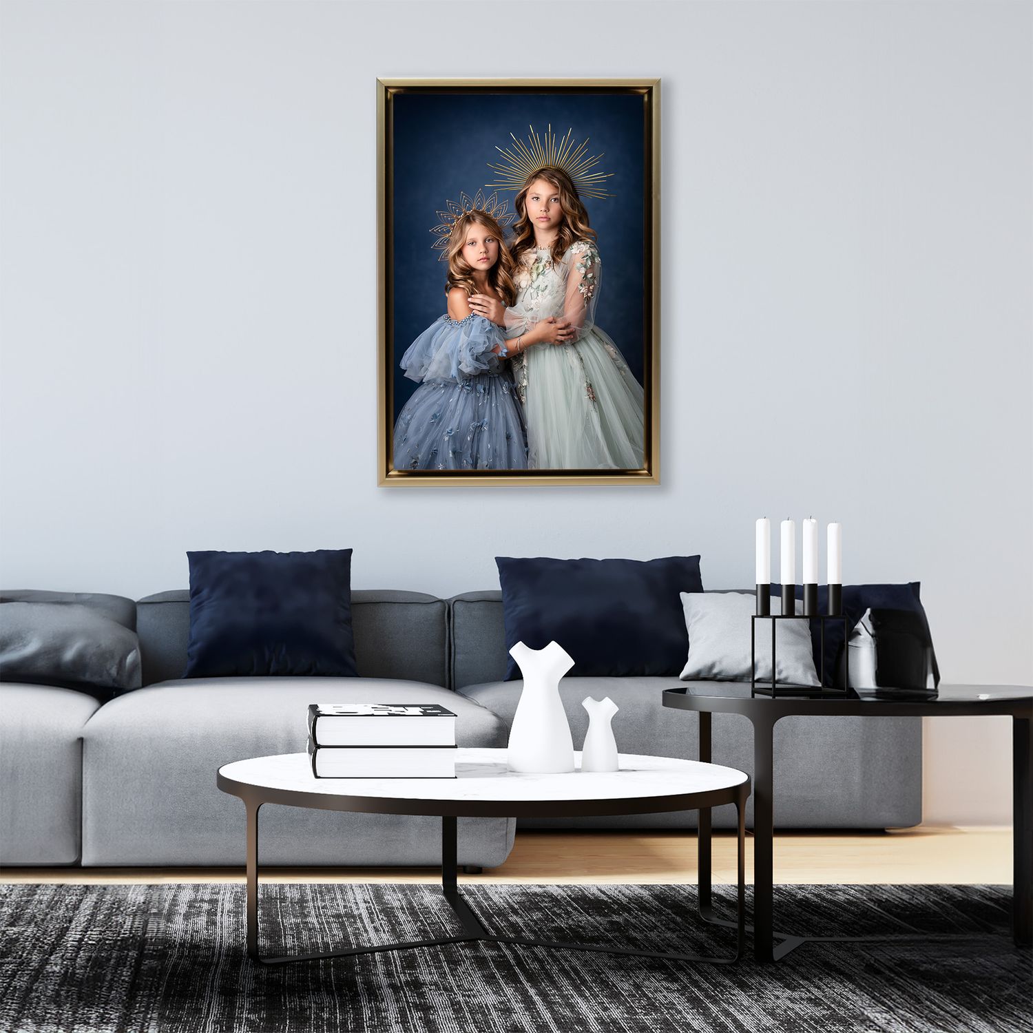 Modern minimalist living room interior with grey sofa, round table and framed artwork on white walls.