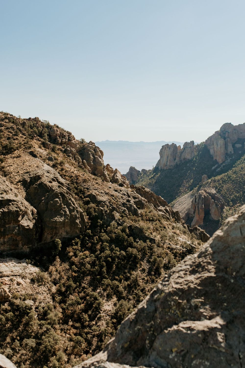 Dramatic mountain landscape with rugged cliffs and deep canyon views.