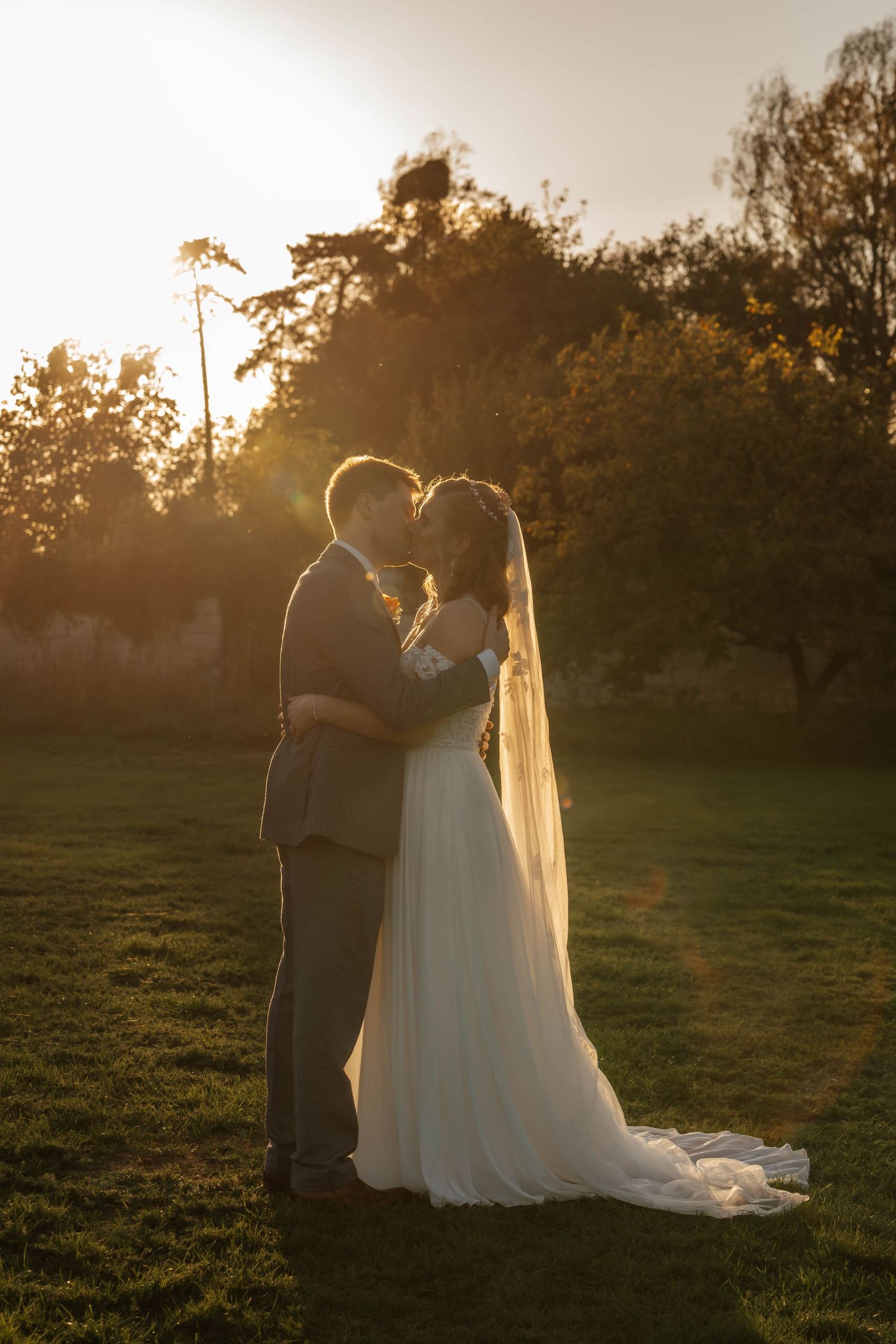 Romantic countryside wedding venue in the Cotswolds Elmore court couple at sunset