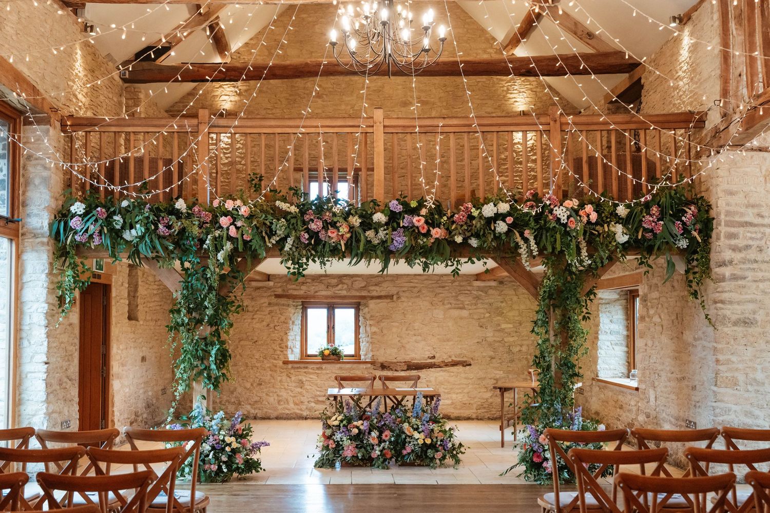 Kingscote Barn Gloucestershire wedding ceremony barn interior