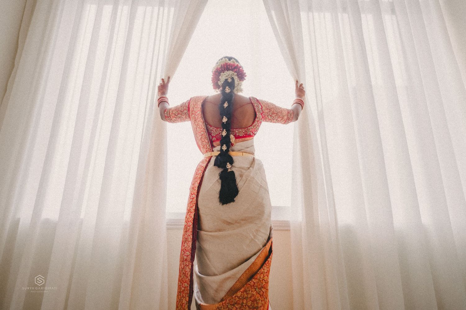 A person in a sleeveless top strikes different poses against a white curtain background in a photo series.