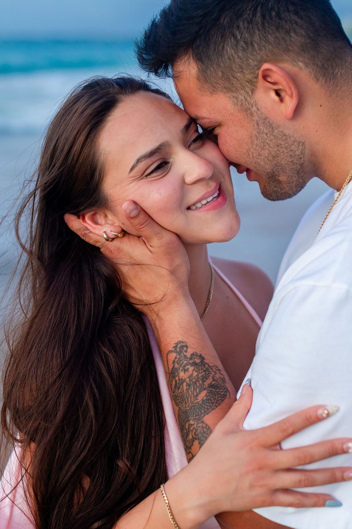 Couples close-up portrait at the beach in Isla Verde, Carolina, Puerto Rico.