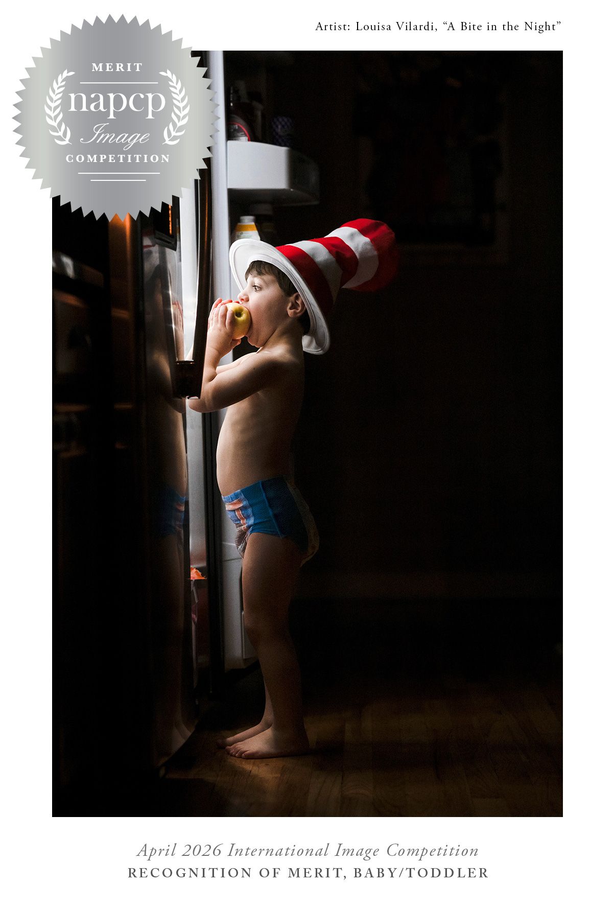 Award-winning photo of toddler in diaper and striped hat sneaking a snack from open refrigerator in dark kitchen.