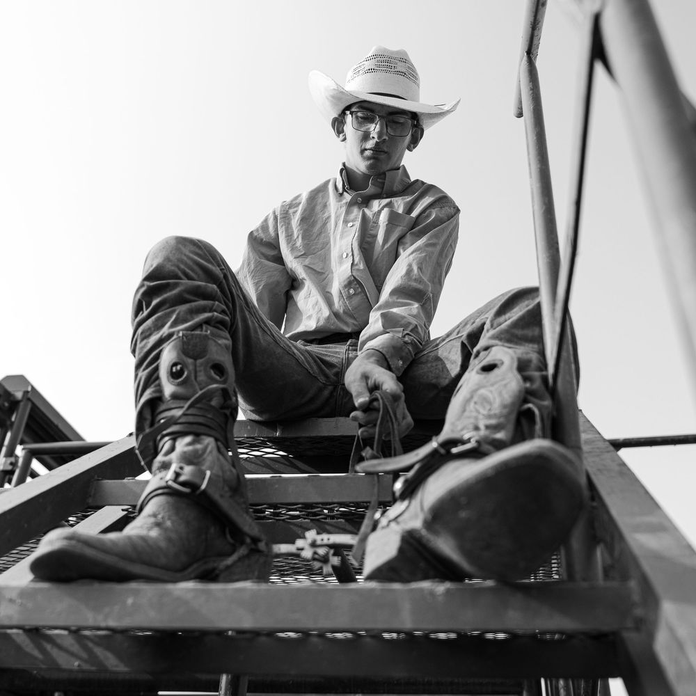 Bull rider getting ready at an amateur rodeo