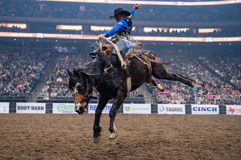 Statler Wright riding a bronc at a PRCA Rodeo in St. Paul, MN