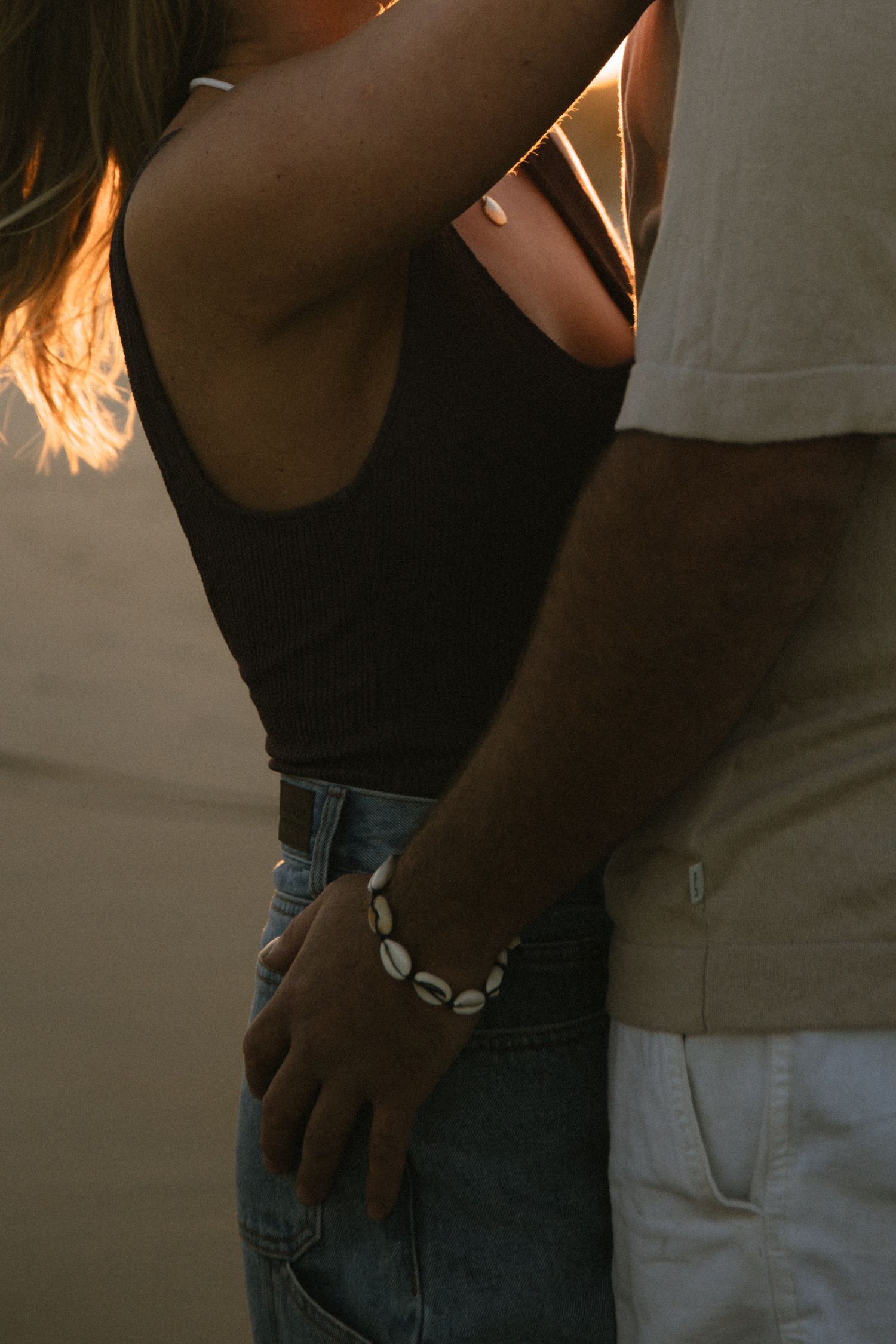 beach couple photoshoot, surf photoshoot, Sunset beach couples photoshoot, coastal couples photography, golden hour portraits.