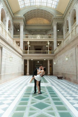 Couple sharing a romantic kiss couples engagement session at the Hartford City Hall in Connecticut