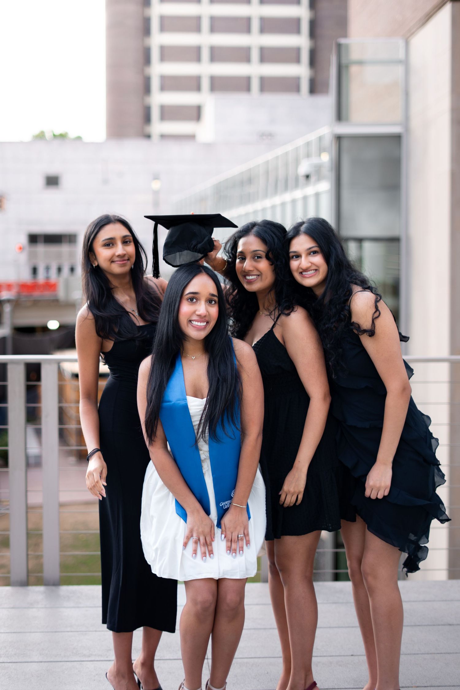 Georgia State graduation group photos in front of the library plaza with city background, one of the best spots on the Atlanta campus