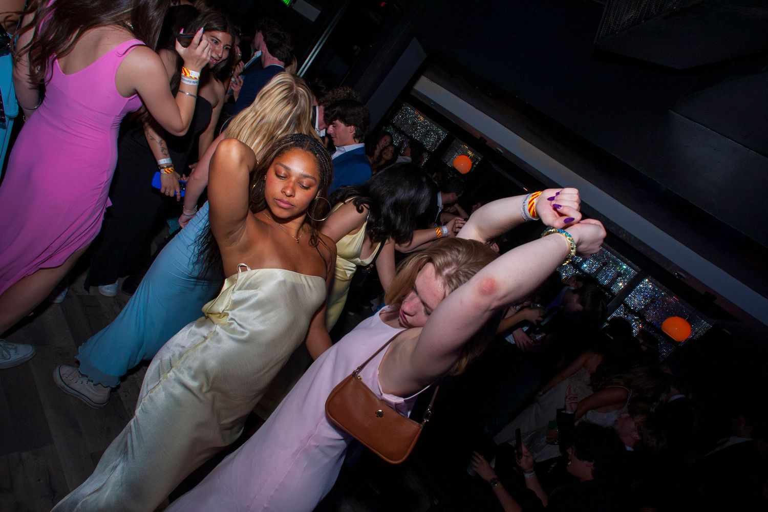 Party girls dance at a Los Angeles nightclub