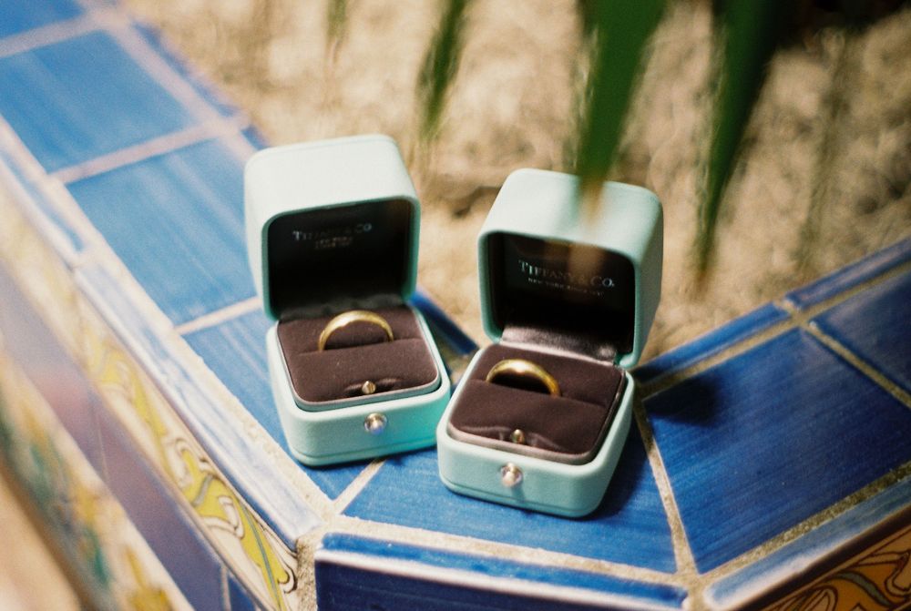 Close-up detail of an LGBT couple's wedding rings  during a Santa Barbara Courthouse elopement.