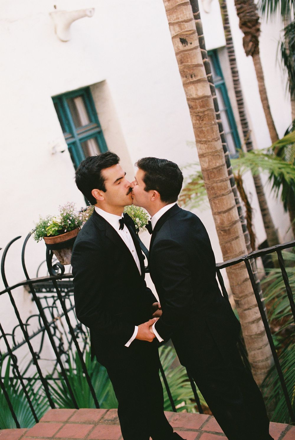 Emotional embrace between an LGBT couple immediately following their intimate courthouse wedding ceremony in Santa Barbara
