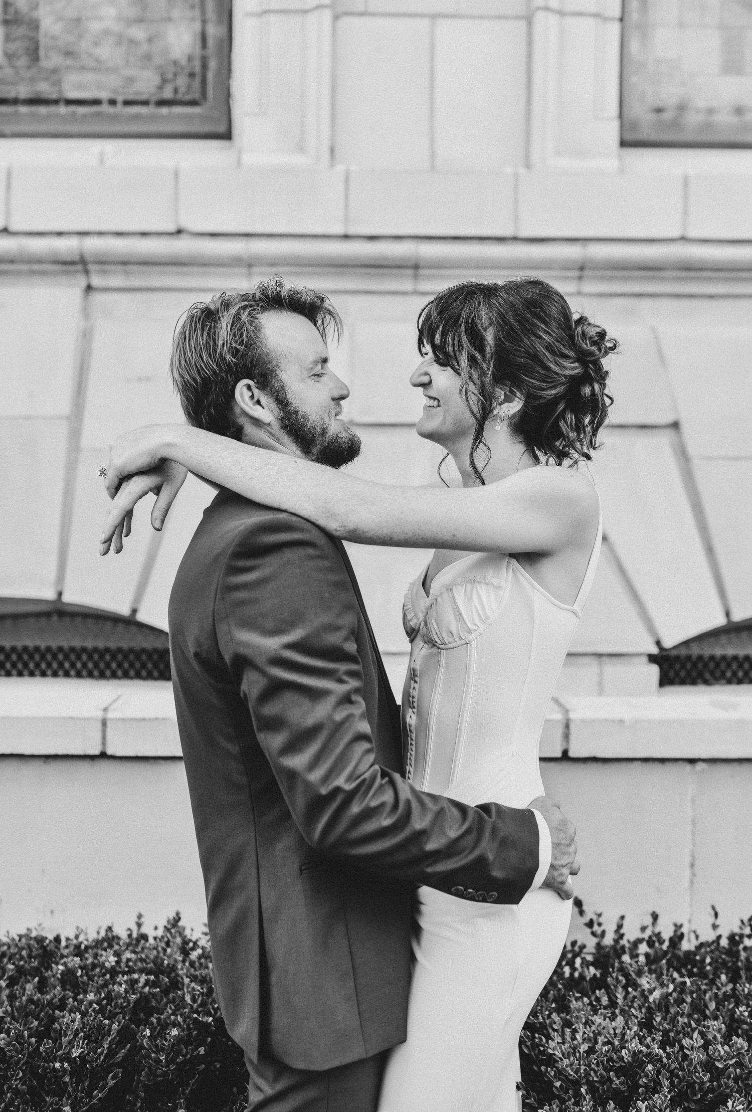 Couple embracing during golden hour in historic Downtown Dallas
