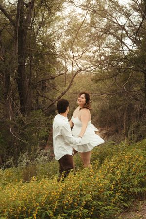Brookings South Dakota couples photography with lush green background, romantic connection, added grain and a warm filmy look.
