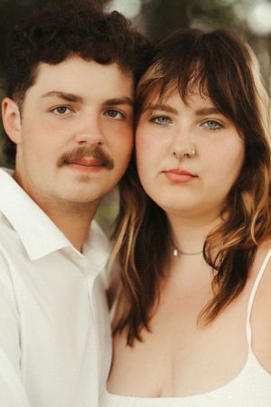 Brookings SD couples photographer capturing an intimate couple session with lush greenery, grainy edits and a soft filmy feel.