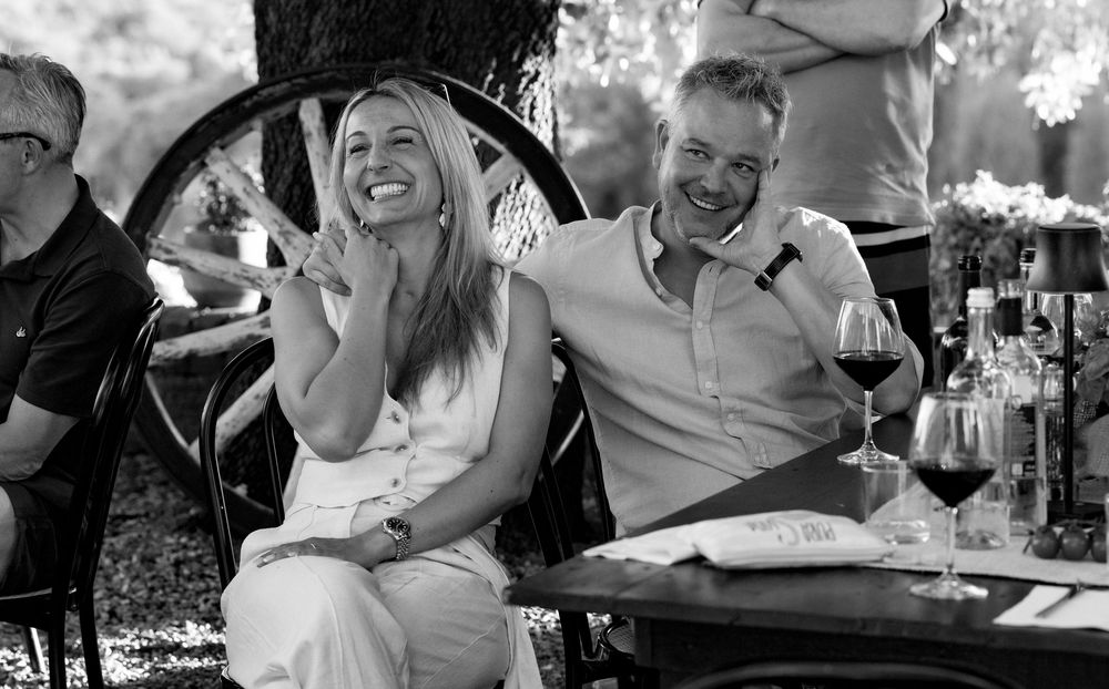 Black and white candid moments from an outdoor celebration.