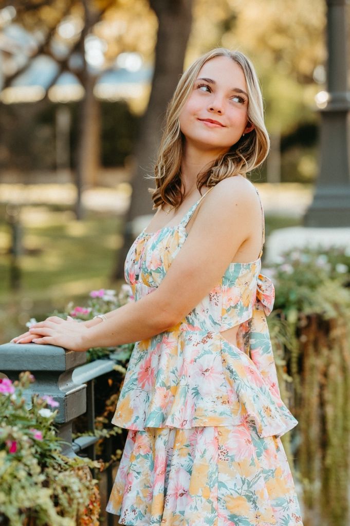 A floral sundress captured in a series of outdoor portrait shots during golden hour.