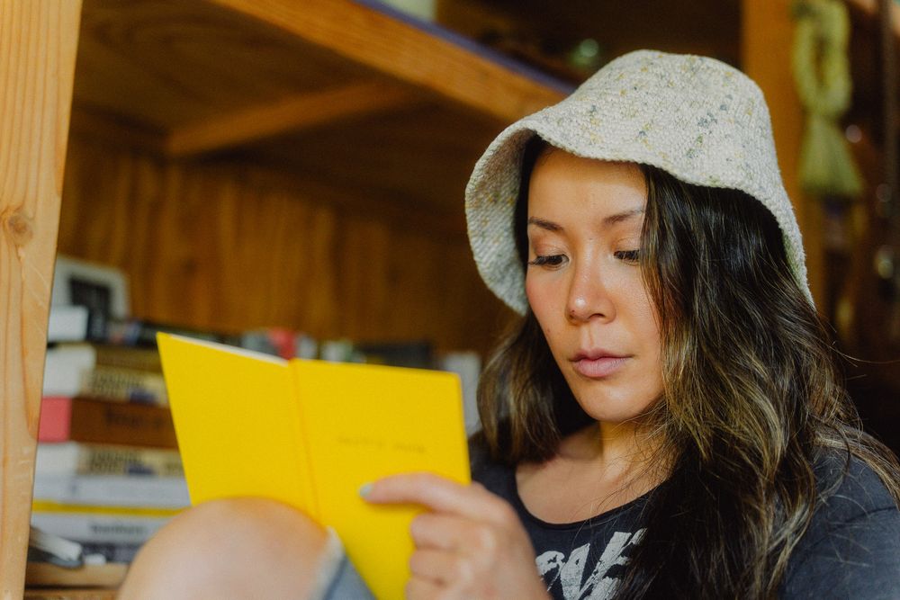 Warm Los Angeles lifestyle image of a small business owner journaling.
