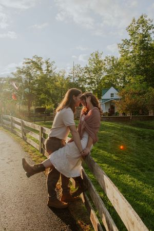 Engagement session featuring a couple laughing together.