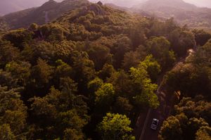 Scenic mountain landscape view with rolling hills at sunset.