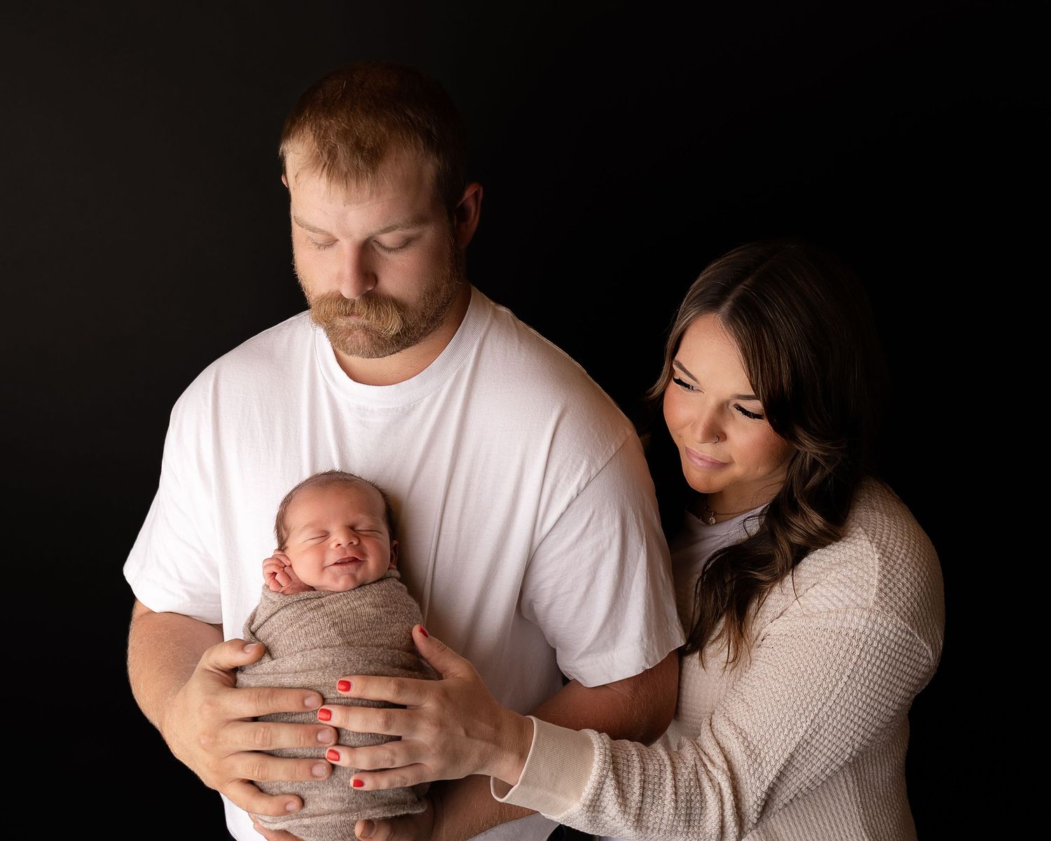 Professional photo of a family with their newborn baby