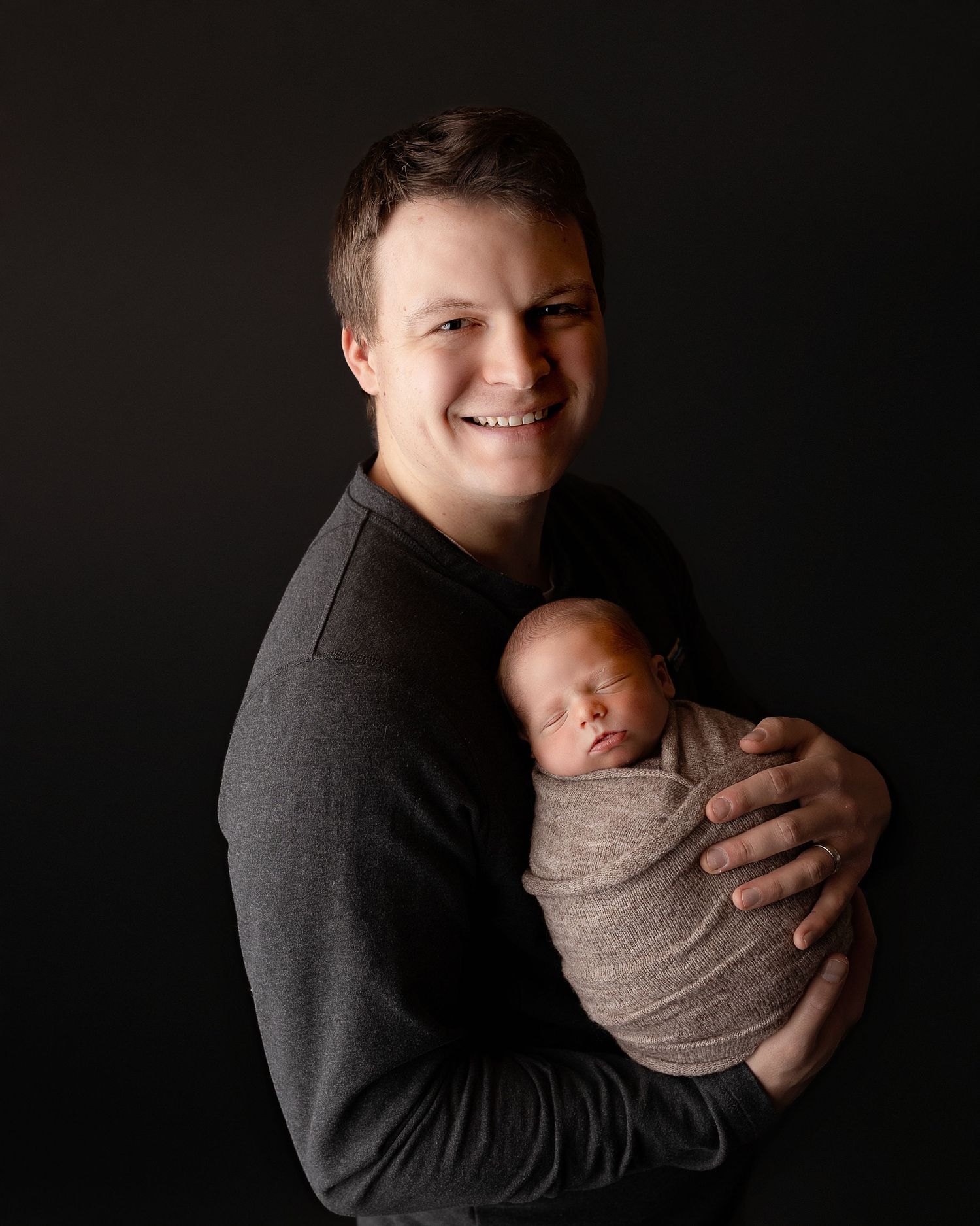 Professional photo of a family with their newborn baby