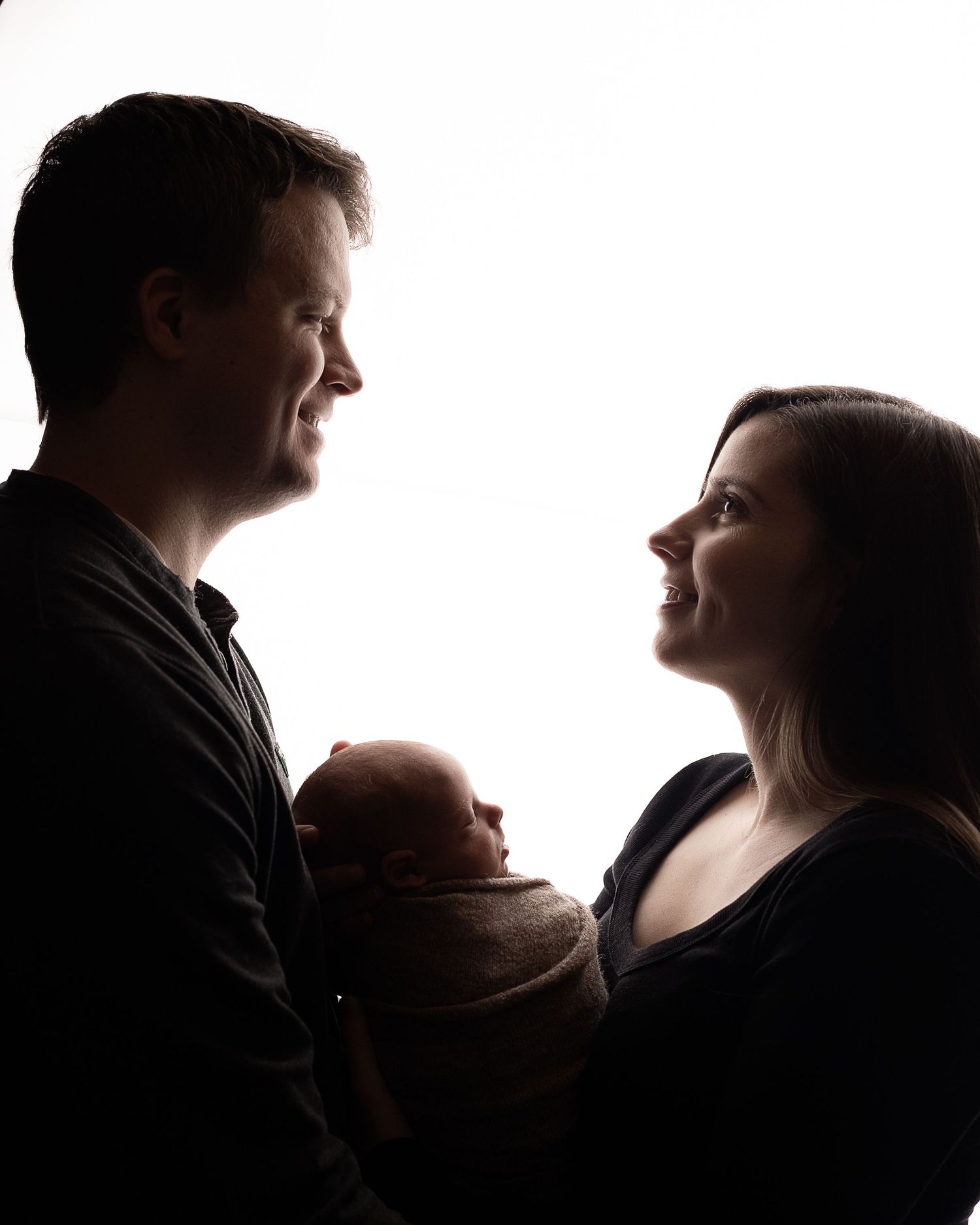 Professional photo of a family with their newborn baby