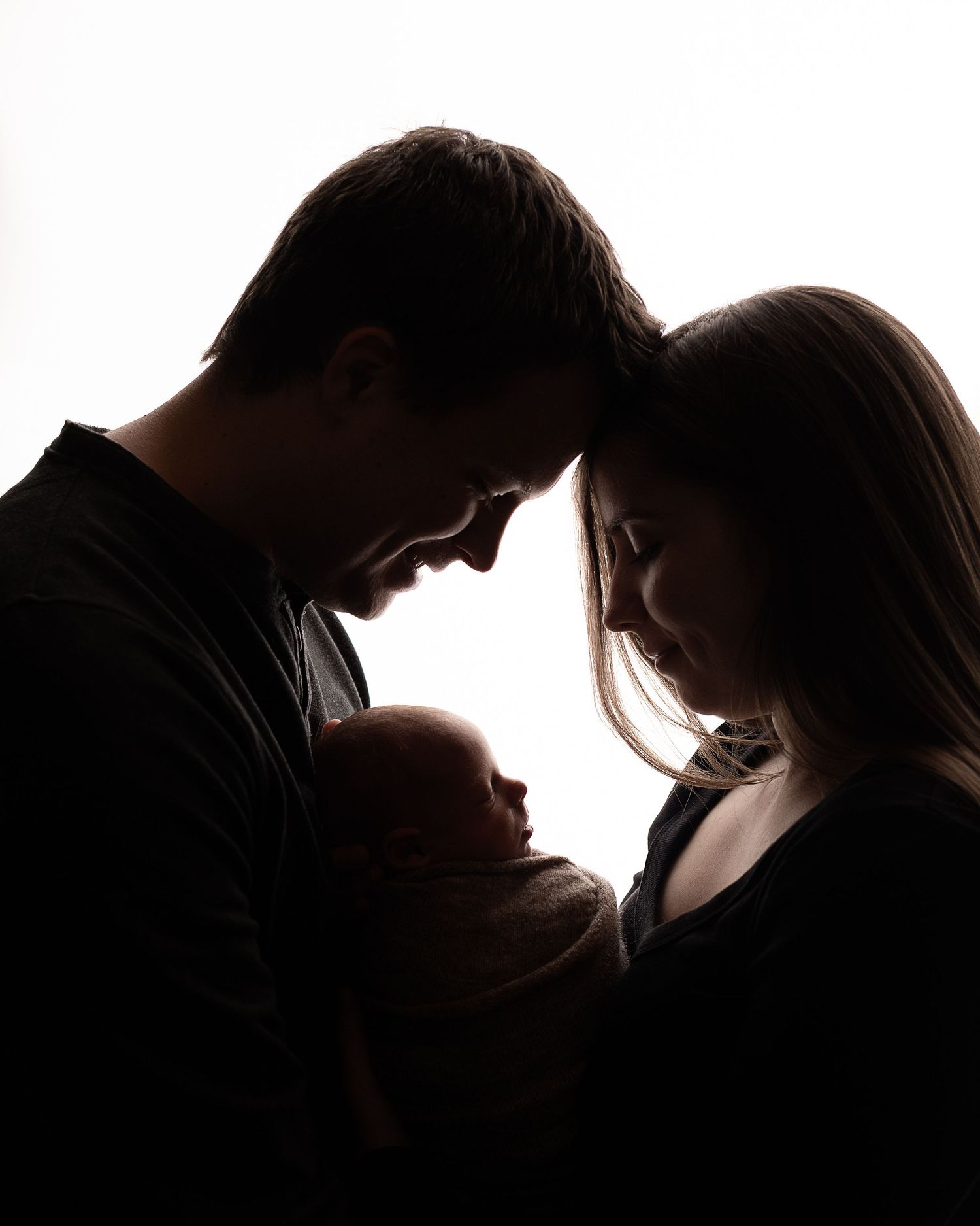 Professional photo of a family with their newborn baby