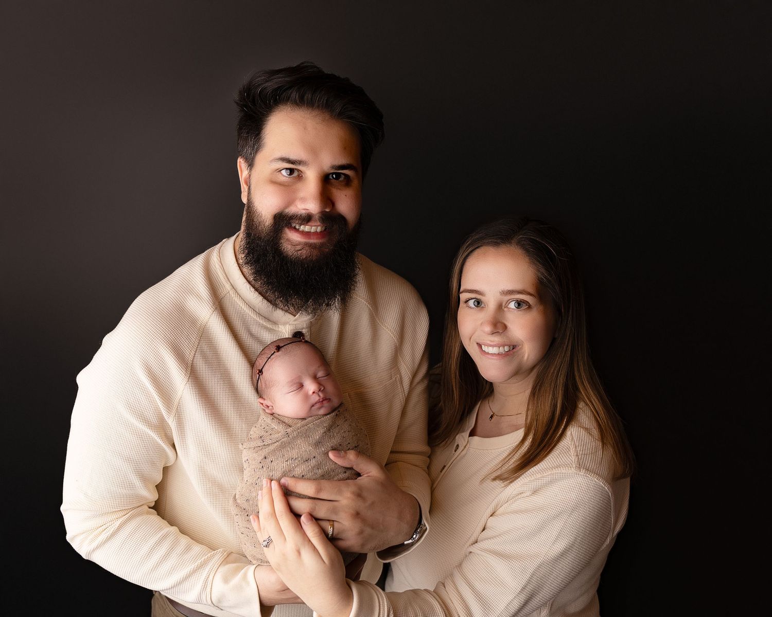 Professional photo of a family with their newborn baby