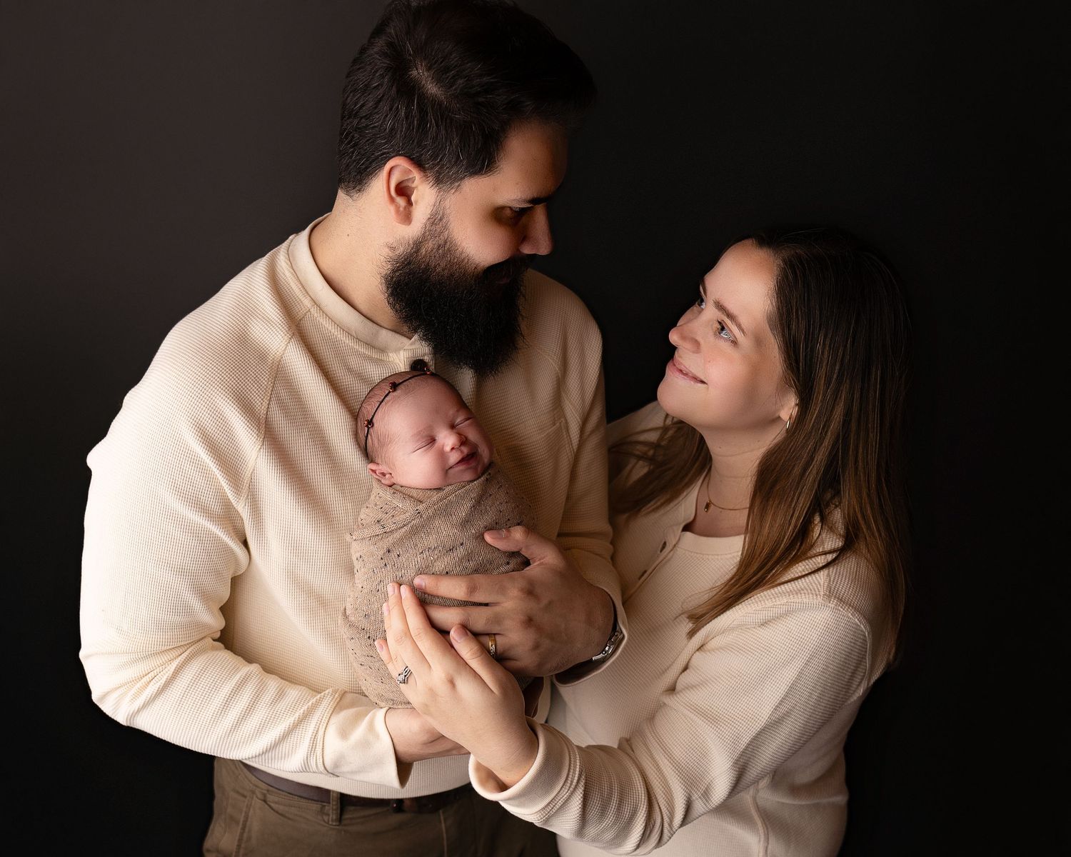 Professional photo of a family with their newborn baby