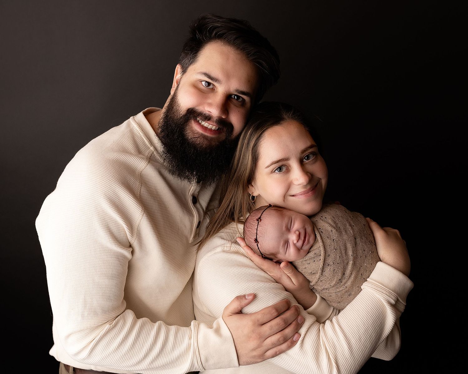 Professional photo of a family with their newborn baby