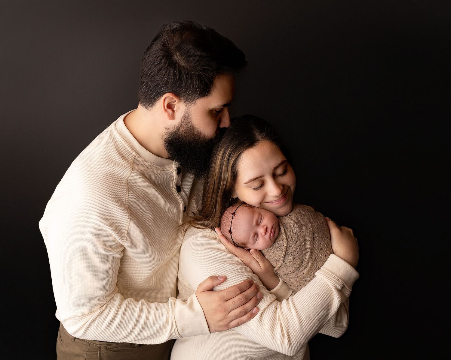 Professional photo of a family with their newborn baby